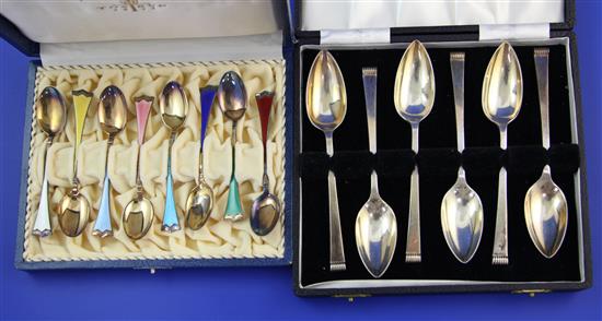 A cased set of eight mid 20th century Norwegian silver gilt and polychrome enamel coffee spoons by J. Tostrup & 1 other set.